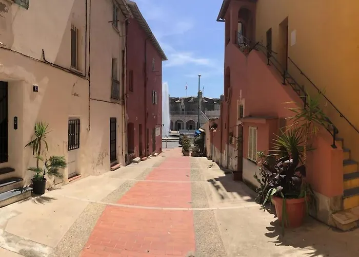 Between The Roofs Of Menton Old Town And The Sea