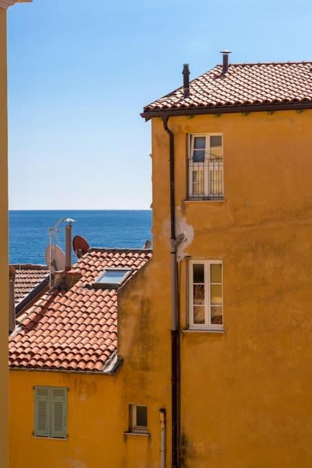 Between The Roofs Of Old Town And The Sea
